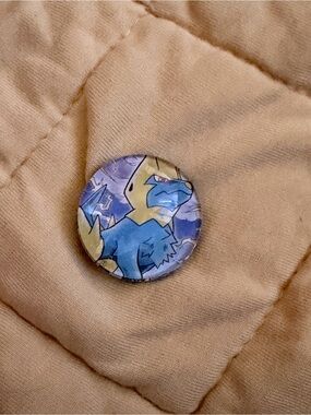 Pokemon Tan Puffer Jacket with Blue Character Button